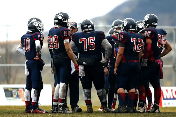 Football team huddling