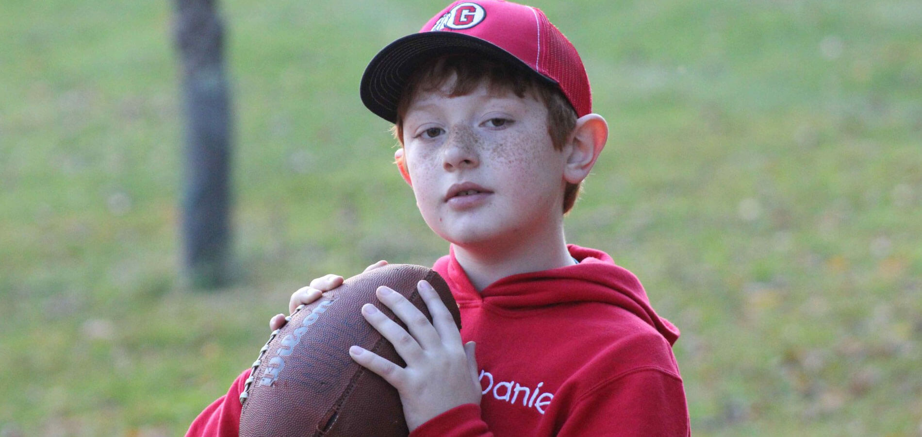 Kid Holding Football